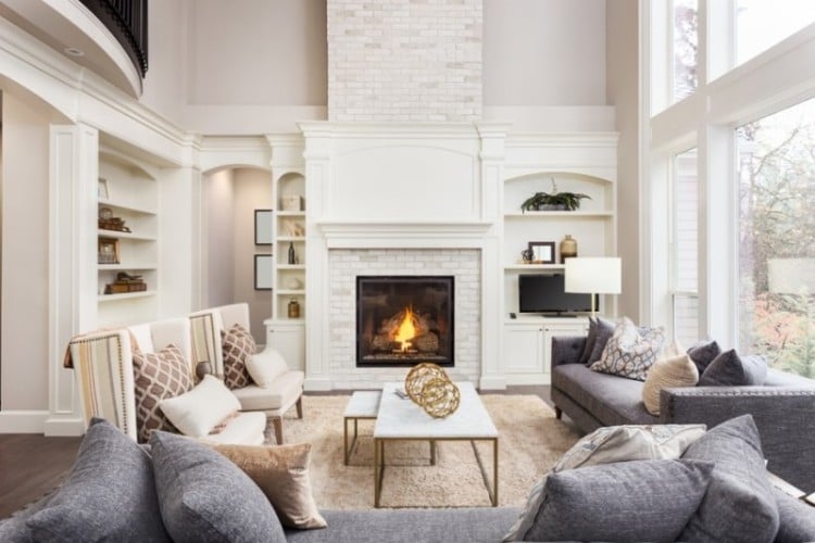Living room with high ceiling and fireplace