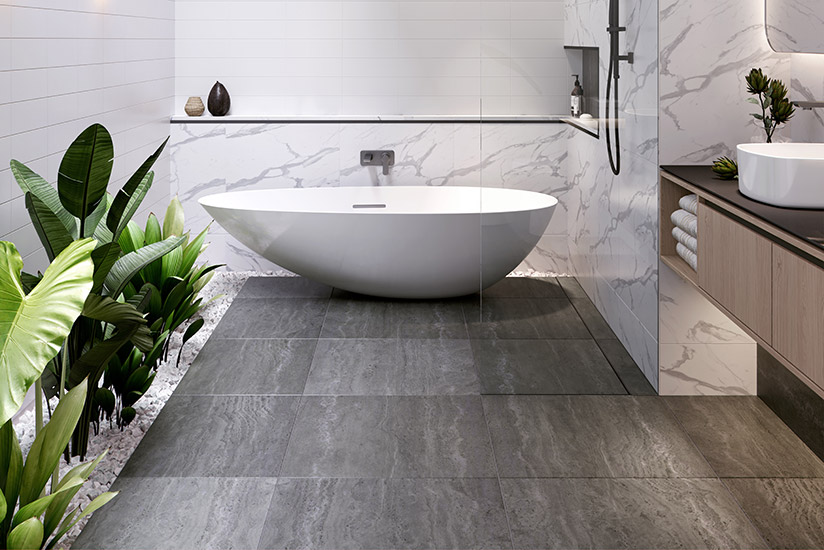 Minimalist bathroom with standing bath and grey tiles