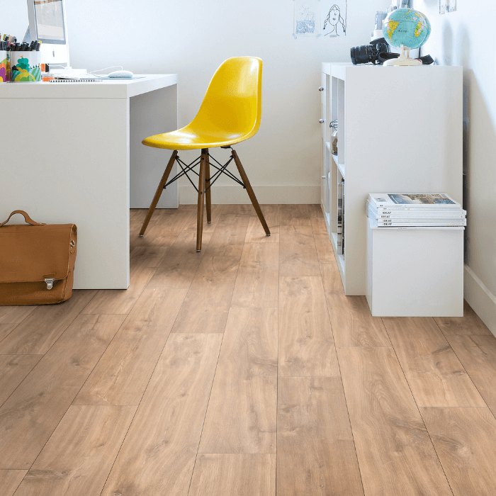 A pale timber-look seamless floor in a home office with a white desk