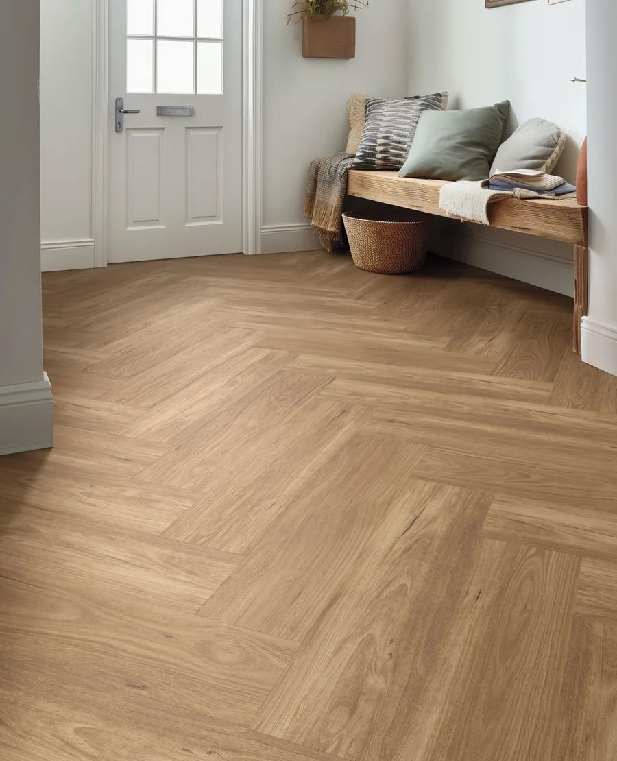 Vinyl plank flooring laid in a herringbone pattern in an entry