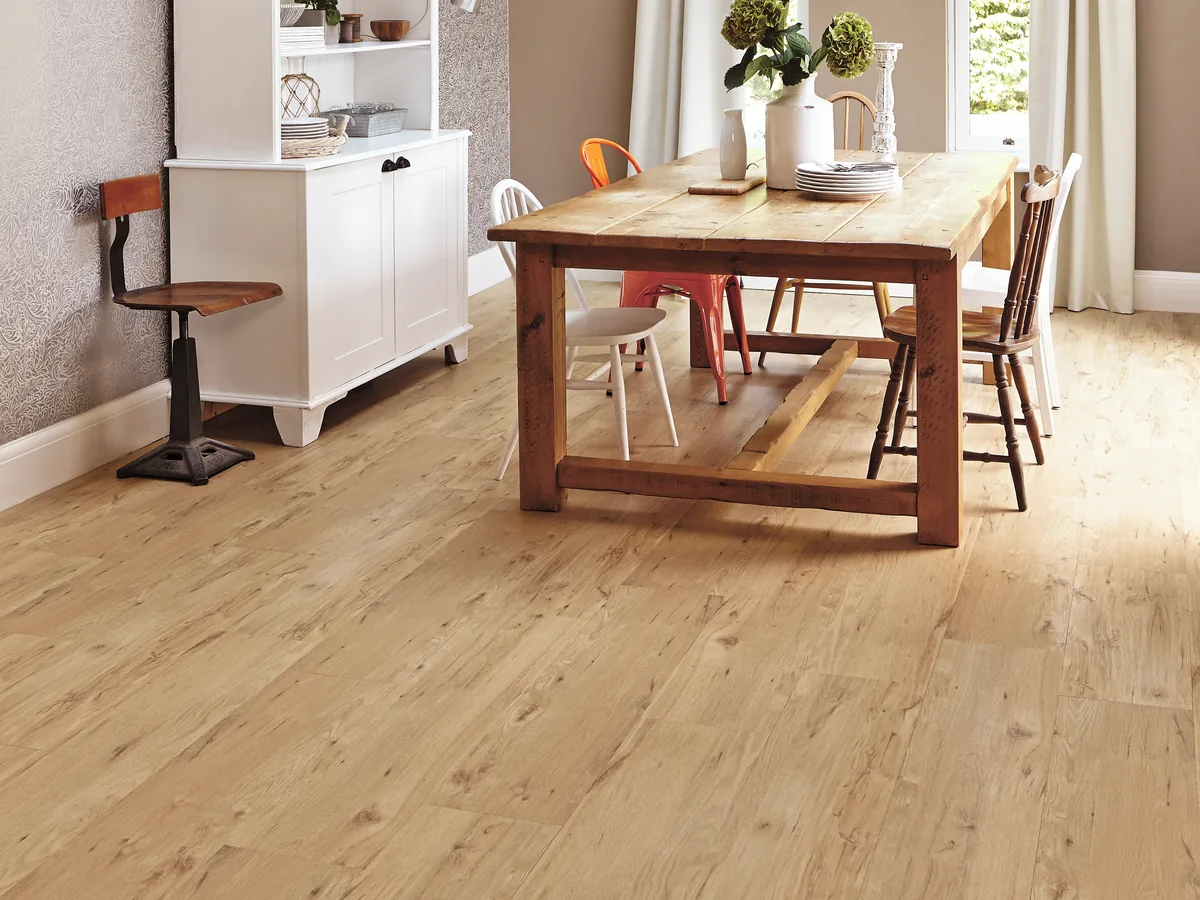 Oak-look vinyl planks in a dining room with a timber table