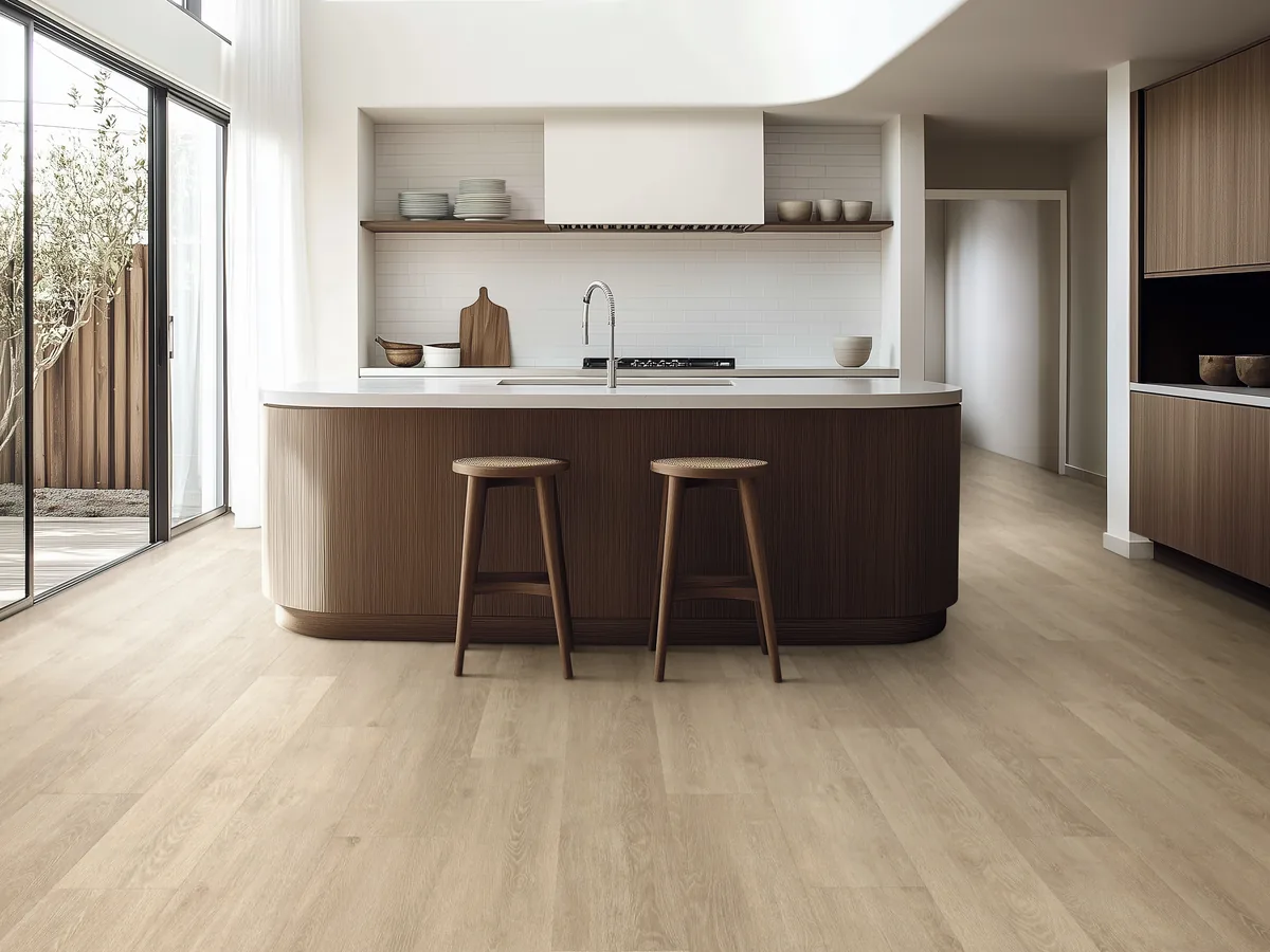 Pale timber-look vinyl planks in a kitchen with an island bench