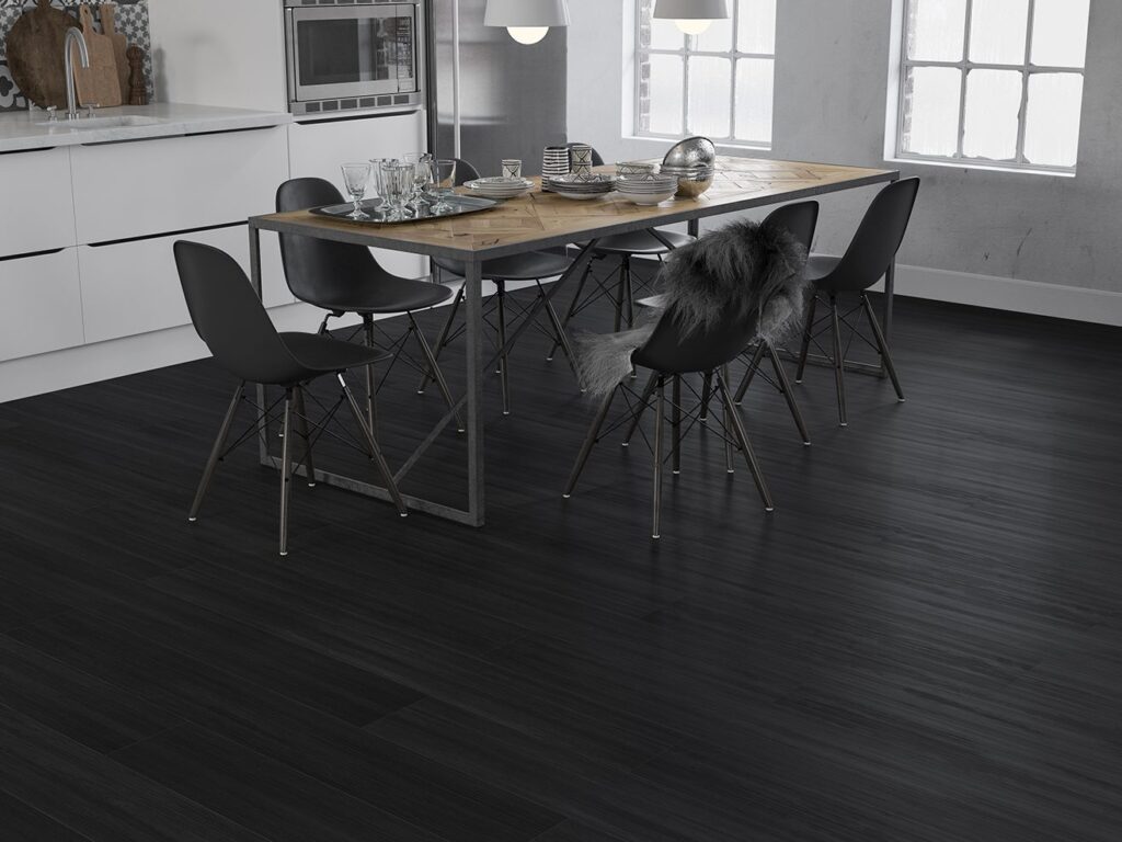 A dark timber-look hybrid floor in an open-plan kitchen and dining area