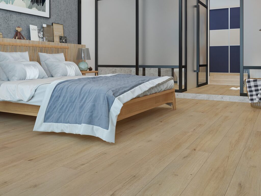 A warm oak-toned timber-look hybrid floor in a bedroom