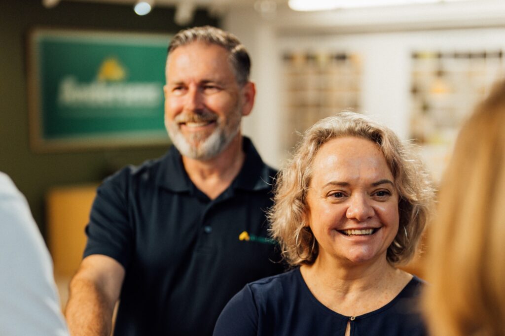 Two Andersens Centenary team members smiling in the showroom