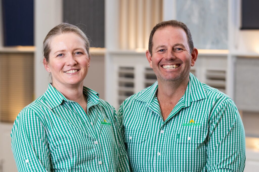 Two Andersens Dalby team members smiling in the showroom